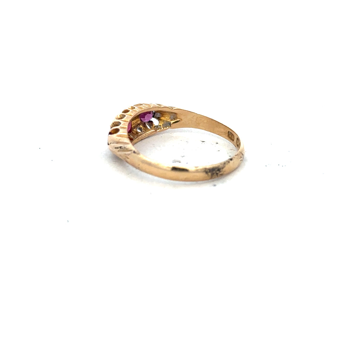 18ct yellow gold ruby and diamond ring, size P, featuring a central ruby surrounded by sparkling diamonds.