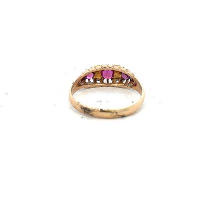 18ct yellow gold ruby and diamond ring, size P, featuring a central ruby and sparkling diamonds.