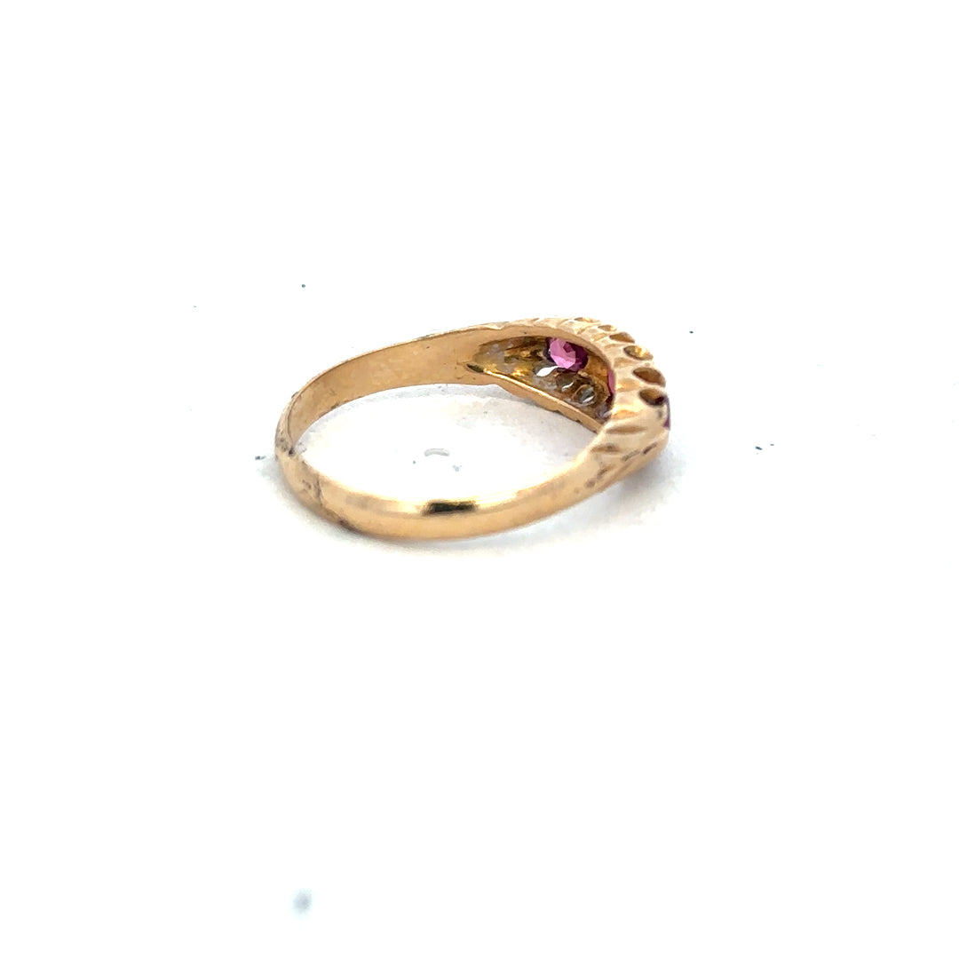 18ct yellow gold ruby and diamond ring in size P, featuring a central ruby surrounded by sparkling diamonds.