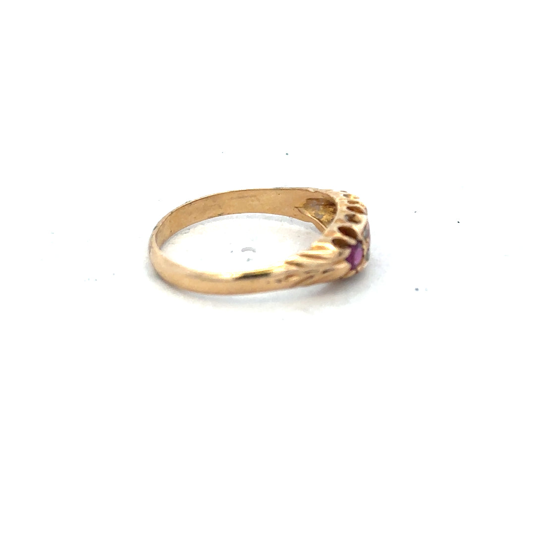 18ct yellow gold ruby and diamond ring in size P, featuring a central ruby surrounded by sparkling diamonds.