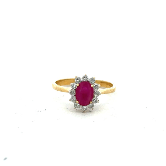 18ct yellow gold ruby and diamond ring, size P, featuring a central ruby surrounded by diamonds, elegant jewelry piece.