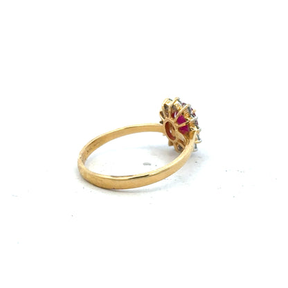 18ct yellow gold ruby and diamond ring in size P, featuring a central ruby with diamond accents, unbranded jewelry accessory.