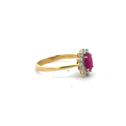 18ct yellow gold ruby and diamond ring size P, featuring a central ruby with diamond accents, elegant jewelry design.