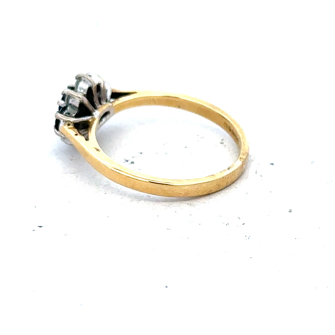 18ct yellow gold sapphire and diamond ring in size K, featuring a central sapphire surrounded by sparkling diamonds.
