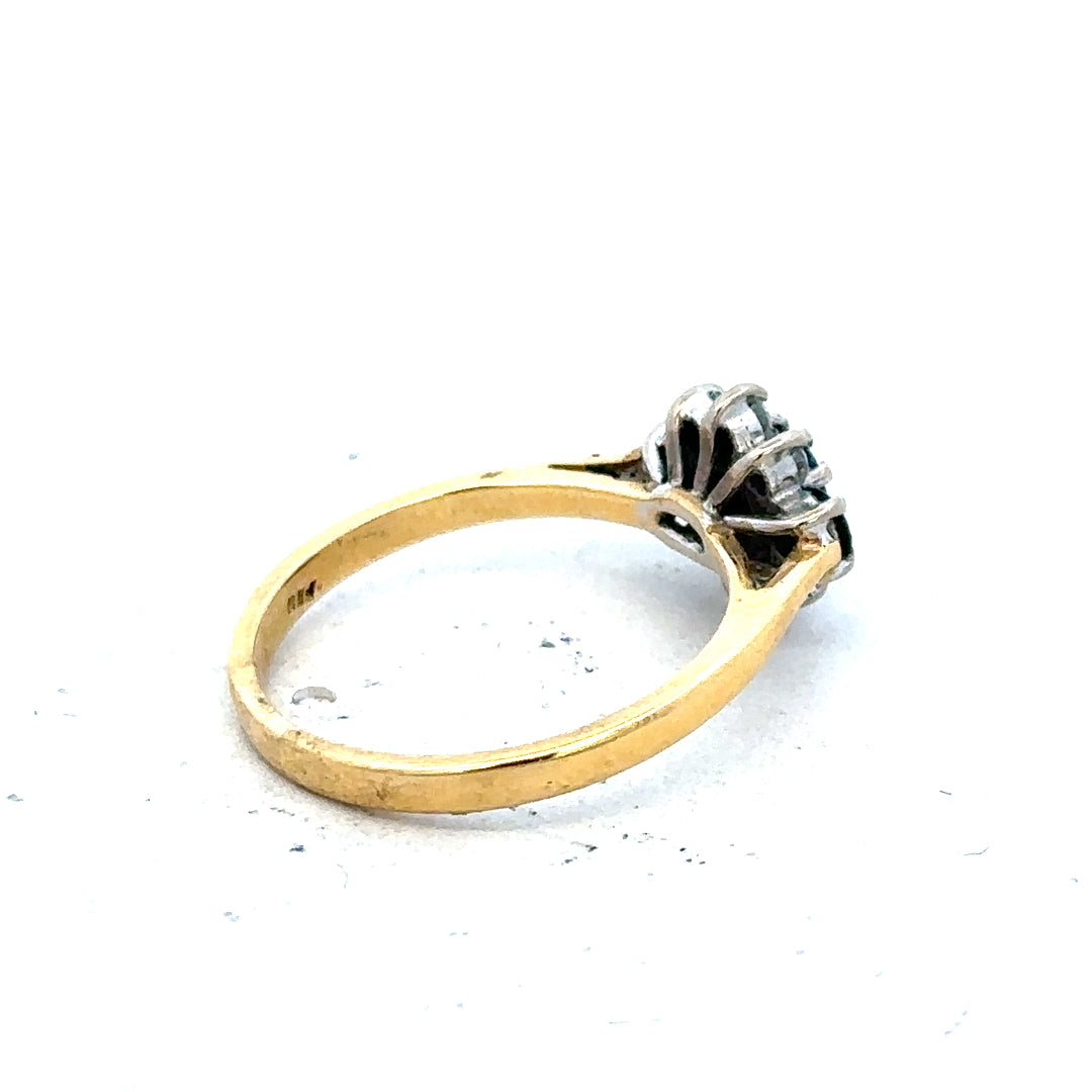 18ct yellow gold sapphire and diamond ring in size K, featuring a vibrant blue sapphire centerpiece and sparkling diamonds.