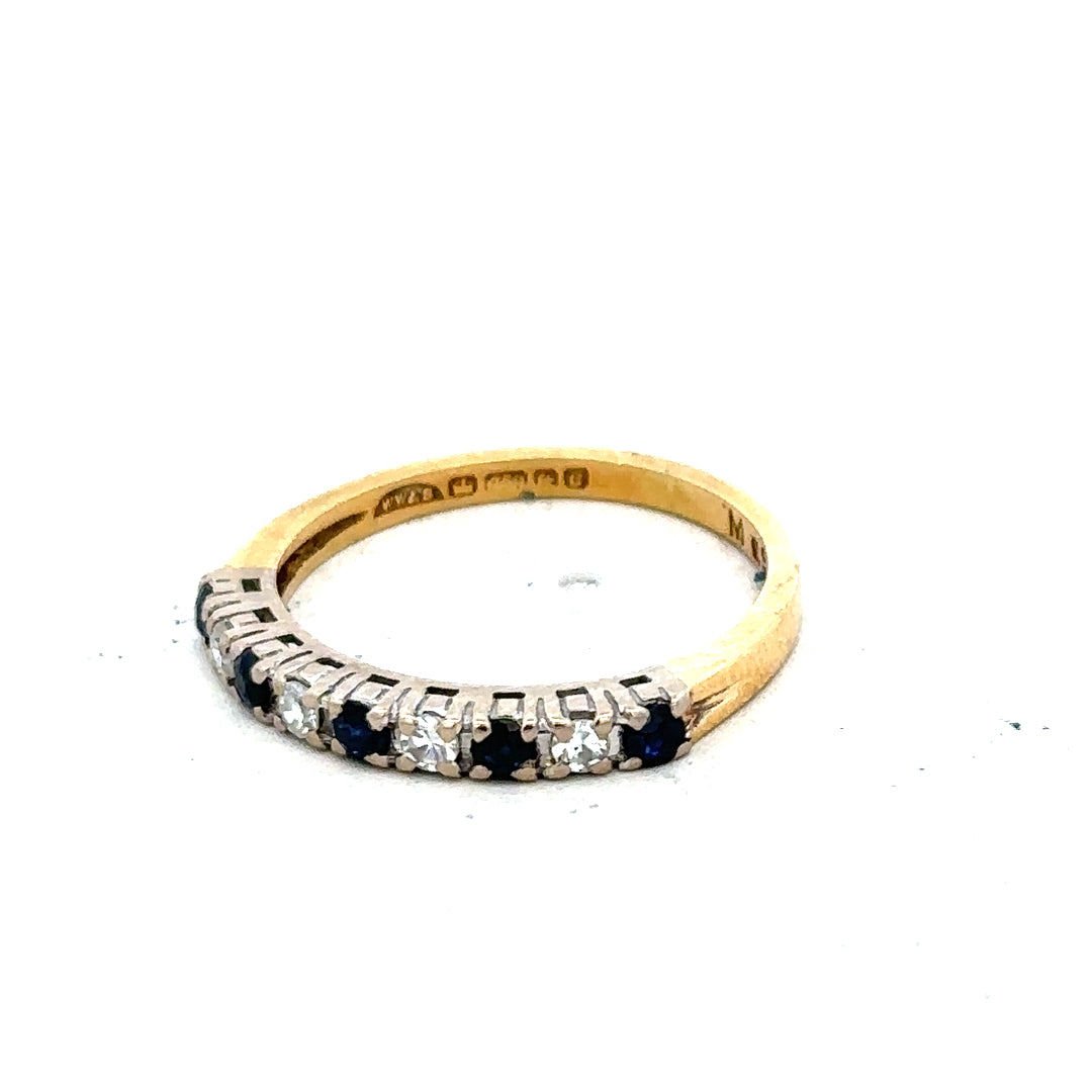 18ct yellow gold sapphire and diamond ring in size L1/2, featuring a vibrant blue sapphire centerpiece with sparkling diamonds.