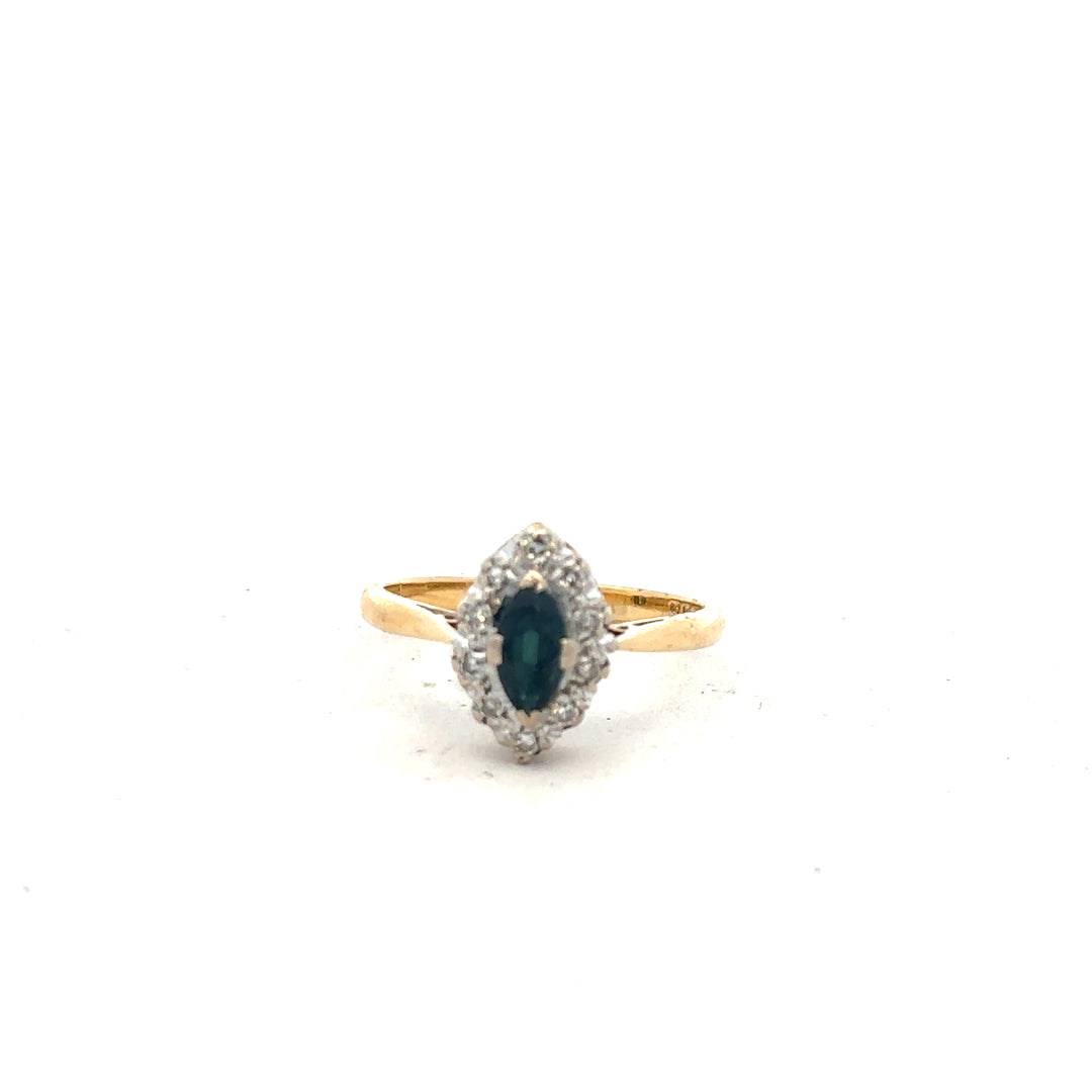 18ct yellow gold sapphire and diamond ring, size M, featuring a vibrant blue sapphire and sparkling diamonds on a sleek band.