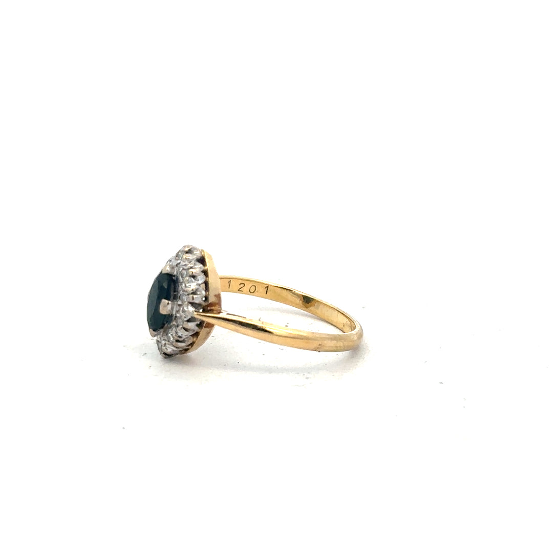 18ct yellow gold sapphire and diamond ring in size M, showcasing a vibrant blue sapphire and sparkling diamonds.