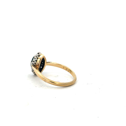 18ct yellow gold sapphire and diamond ring, size M, featuring a central blue sapphire surrounded by sparkling diamonds.