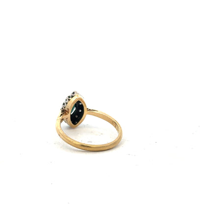 18ct yellow gold sapphire and diamond ring in size M, featuring a vibrant blue sapphire centerpiece with sparkling diamonds.