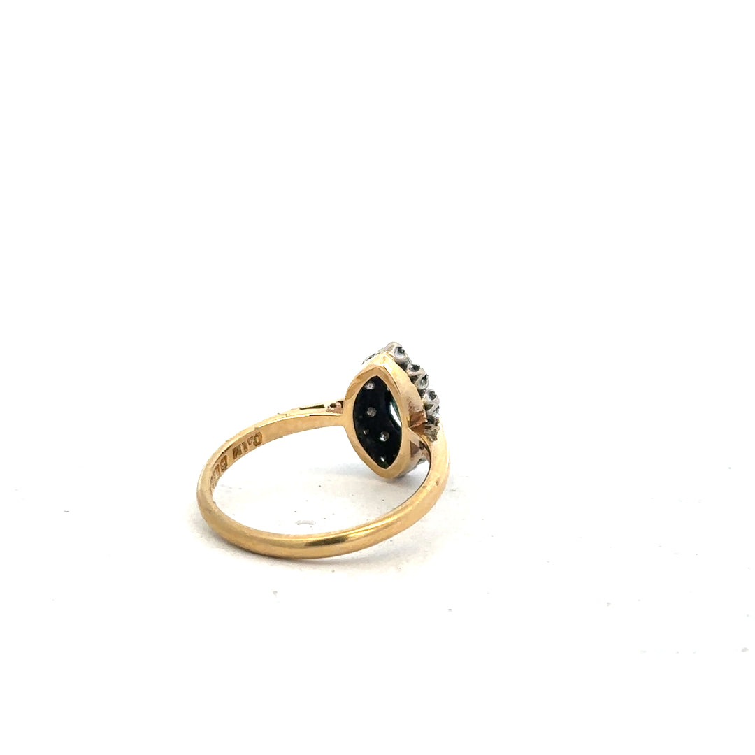 18ct yellow gold sapphire and diamond ring, size M, featuring a vibrant blue sapphire with sparkling diamonds.