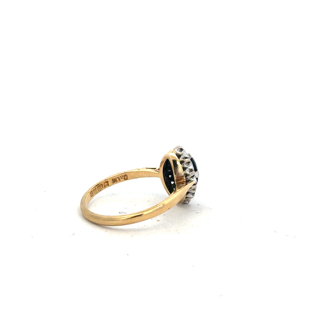 18ct yellow gold sapphire and diamond ring in size M, featuring a vibrant blue sapphire and sparkling diamonds.