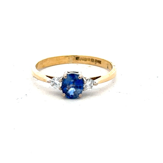18ct yellow gold sapphire and diamond ring, size M, featuring a central sapphire gemstone surrounded by diamonds.
