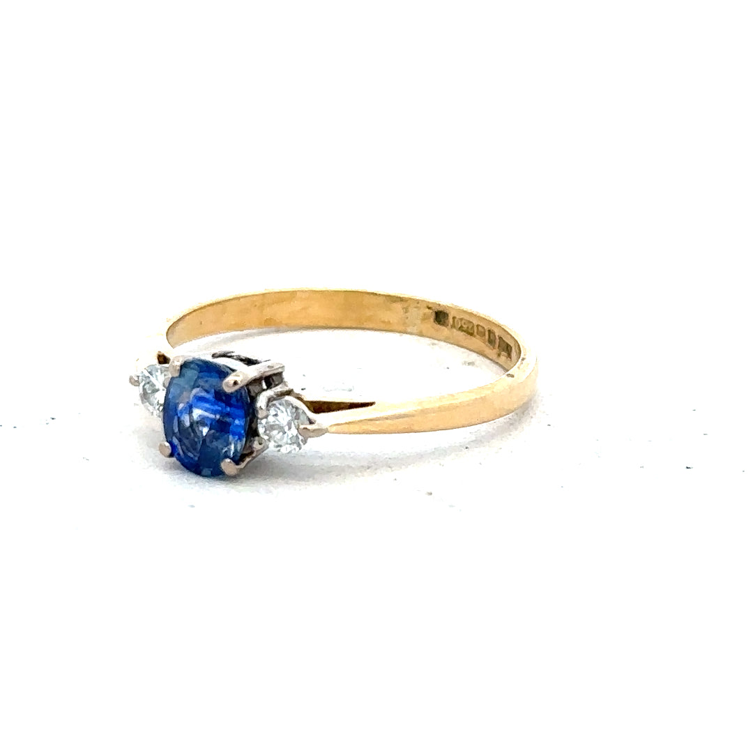 18ct yellow gold sapphire and diamond ring in size M, featuring a detailed design with sparkling gemstones.