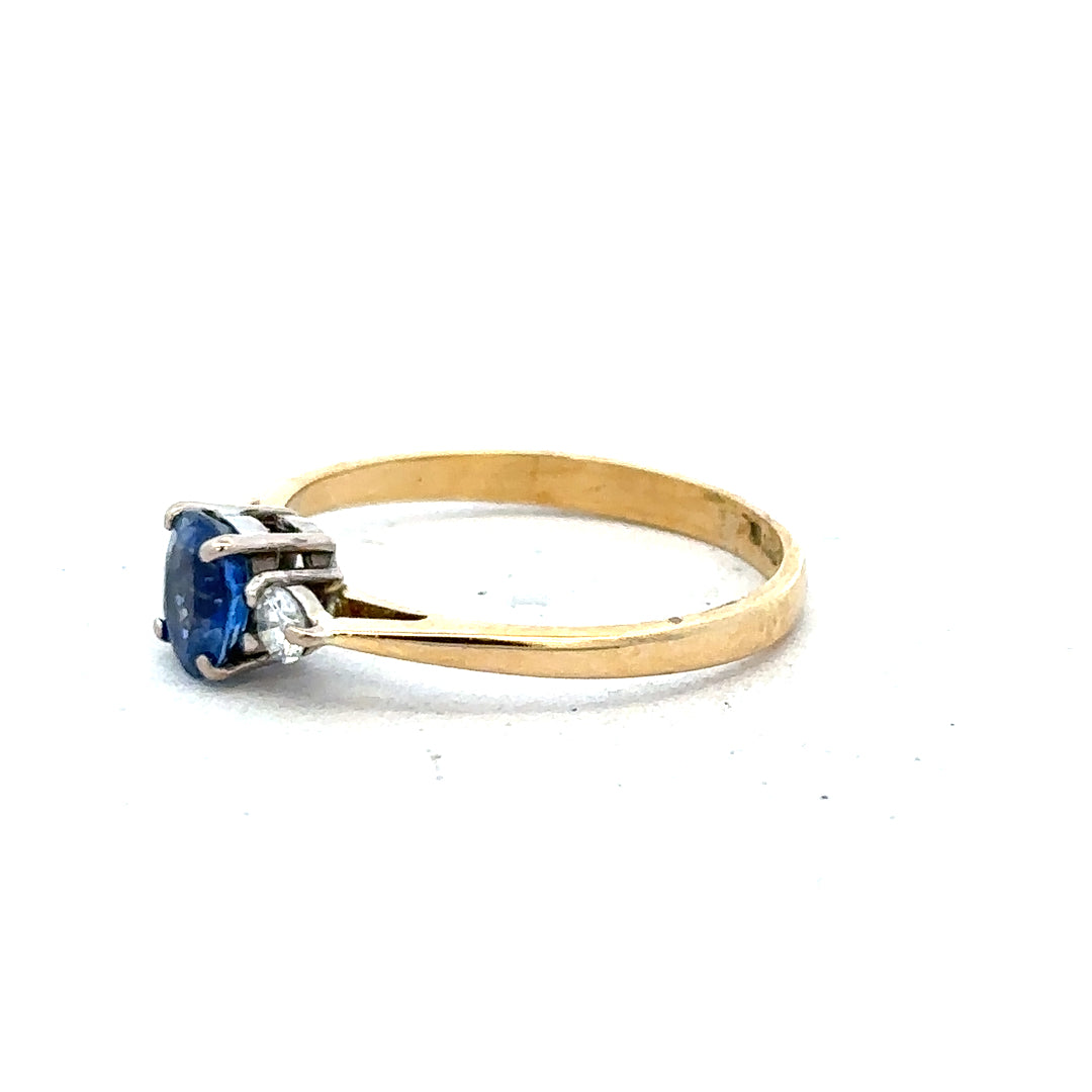 18ct yellow gold sapphire and diamond ring in size M, featuring a vibrant sapphire center with sparkling diamonds.