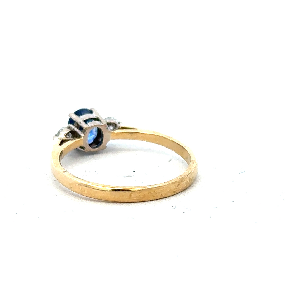 18ct yellow gold sapphire and diamond ring in size M, featuring a vibrant blue sapphire and sparkling diamonds.