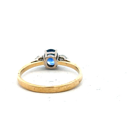 18ct yellow gold sapphire and diamond ring in size M, featuring a central sapphire with diamond accents, elegant jewelry design