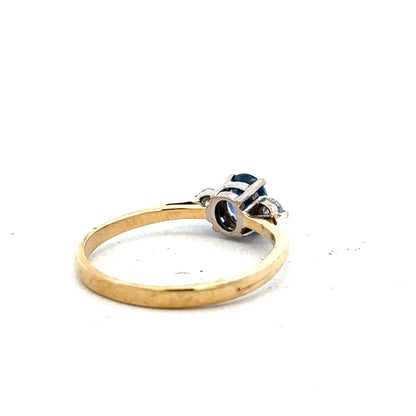 18ct yellow gold sapphire and diamond ring, size M, featuring a central sapphire stone with diamond accents.