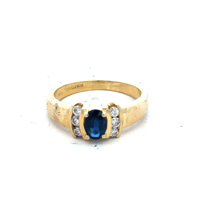 18ct yellow gold sapphire and diamond ring in size M, featuring a stunning blue sapphire centerpiece with sparkling diamonds.
