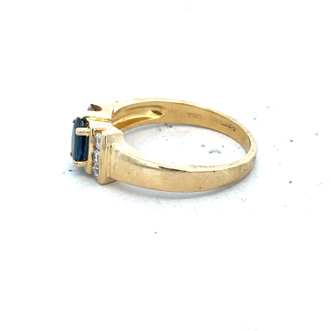 18ct yellow gold sapphire and diamond ring in size M, showcasing a vibrant blue sapphire center stone with sparkling diamonds.
