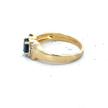 18ct yellow gold sapphire and diamond ring in size M, showcasing a vibrant blue sapphire center stone with sparkling diamonds.