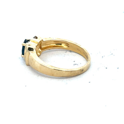 18ct yellow gold sapphire and diamond ring in size M, featuring a central sapphire gemstone surrounded by sparkling diamonds.