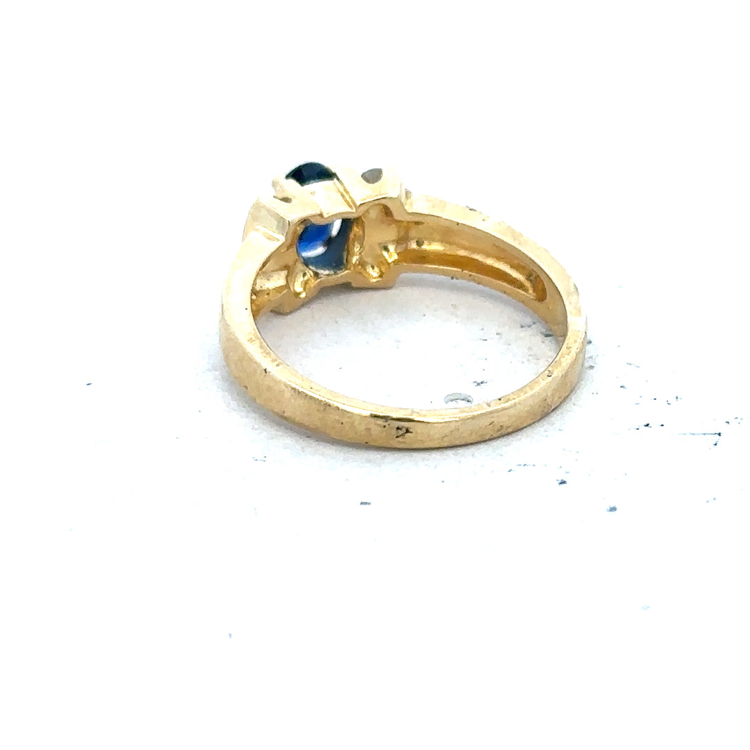 18ct yellow gold sapphire and diamond ring in size M, featuring a elegant design with sparkling gemstones.