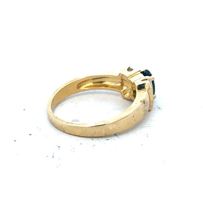 18ct yellow gold sapphire and diamond ring in size M, featuring a central sapphire with diamond accents, elegant jewelry piece