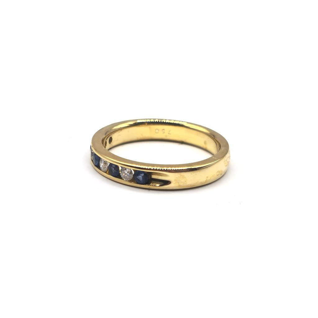 18ct yellow gold sapphire and diamond ring in size N, featuring a central sapphire with diamond accents.