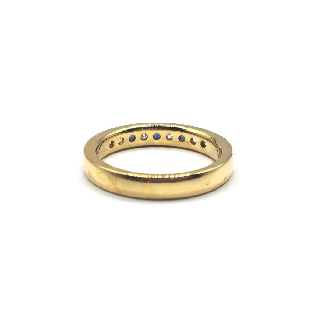 18ct yellow gold sapphire and diamond ring in size N, featuring a central sapphire and sparkling diamonds.