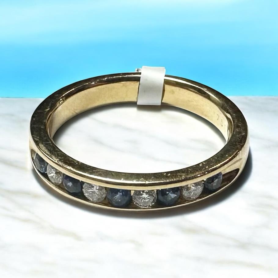 18ct yellow gold sapphire and diamond ring in size N, featuring a vibrant blue sapphire and sparkling diamonds.