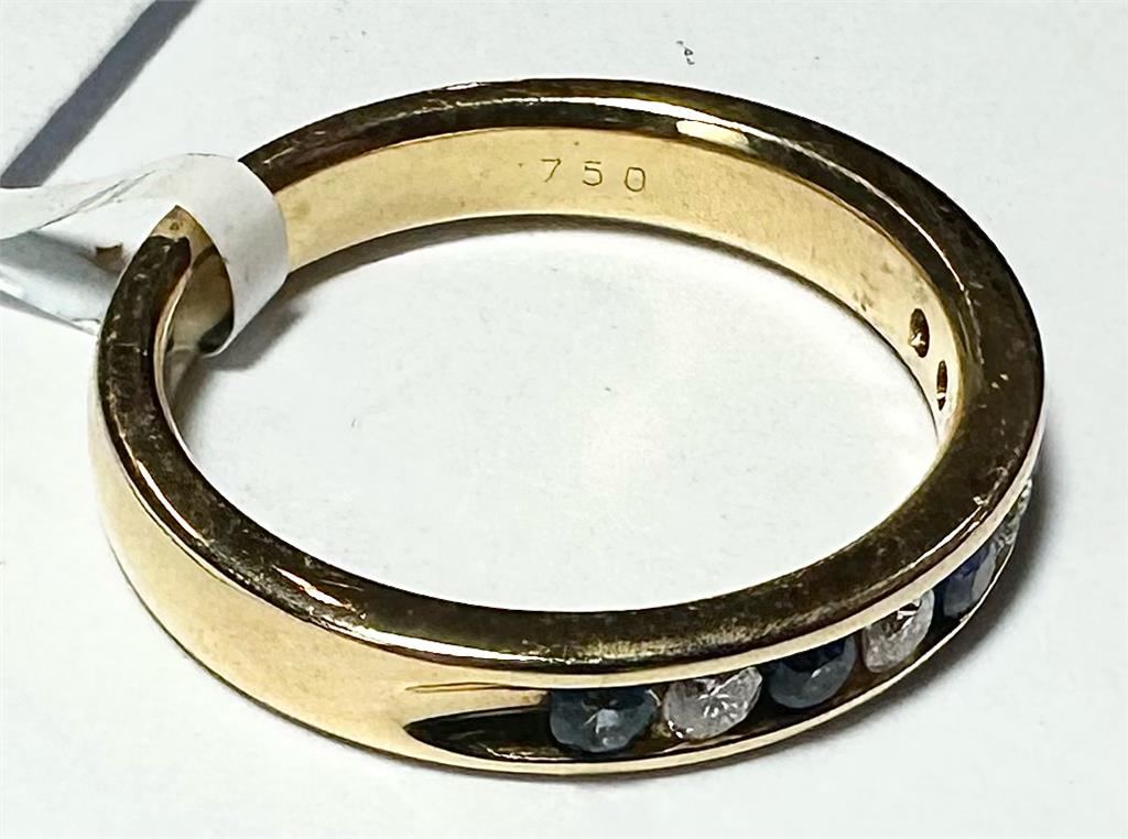 18ct yellow gold sapphire and diamond ring with size N, featuring a central sapphire surrounded by sparkling diamonds.