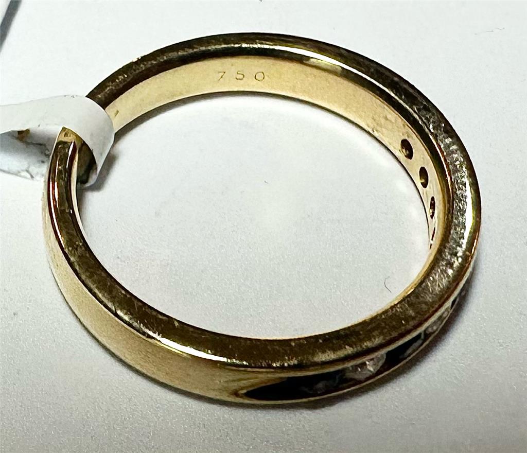 18ct yellow gold sapphire and diamond ring in size N, featuring a central sapphire with diamond accents.