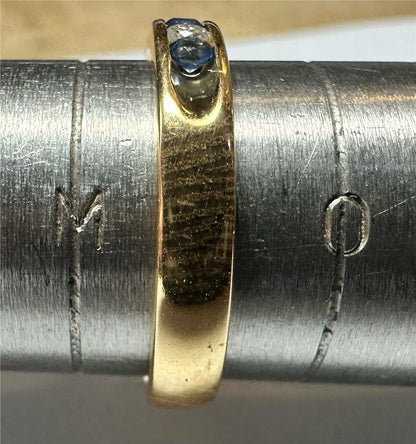 18ct yellow gold sapphire and diamond ring in size N, featuring a vibrant sapphire center with sparkling diamonds.
