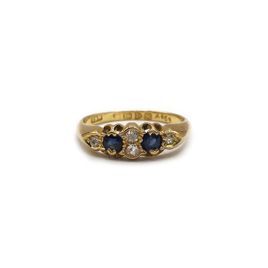 18ct yellow gold sapphire and diamond ring, size N1/2, showcasing a vibrant sapphire and sparkling diamonds against a gold band.