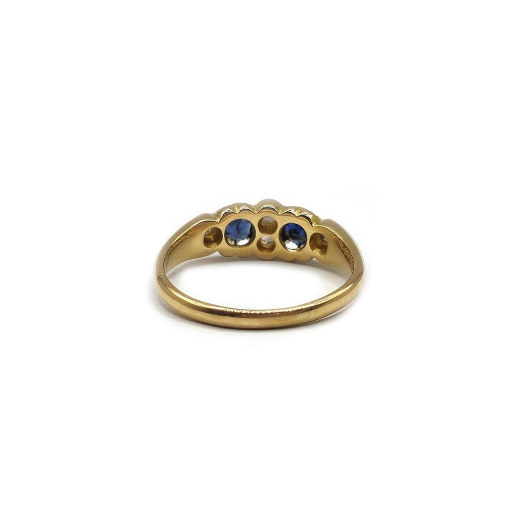 18ct yellow gold sapphire and diamond ring in size N1/2, featuring a central sapphire with diamond accents, unbranded jewelry.