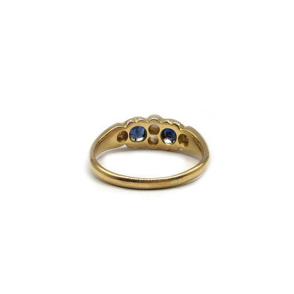 18ct yellow gold sapphire and diamond ring in size N1/2, featuring a central sapphire with diamond accents, unbranded jewelry.