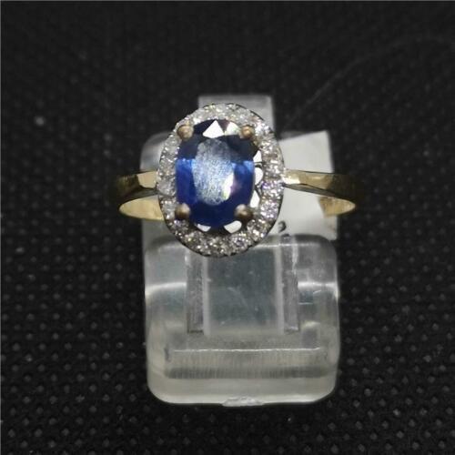 18ct yellow gold ring featuring a central sapphire gemstone surrounded by sparkling diamonds.