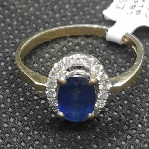 18ct yellow gold sapphire and diamond ring with a central blue sapphire and sparkling diamonds, elegant jewelry design