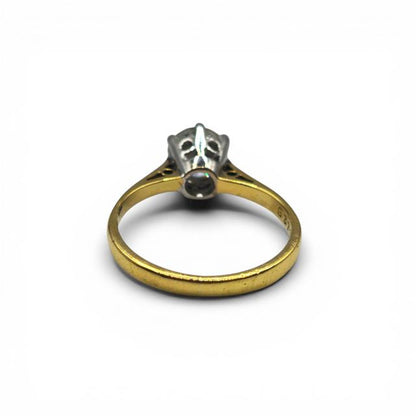 18ct yellow gold single diamond ring with a central diamond, elegant jewelry piece showcasing fine craftsmanship.