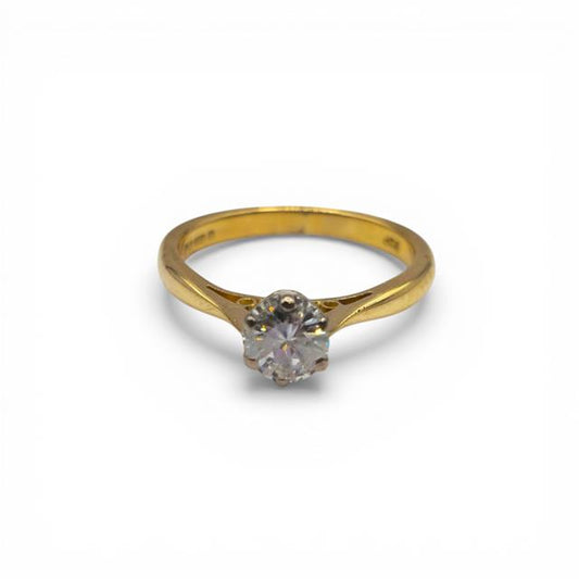 18ct yellow gold single stone diamond ring with a sparkling central diamond, showcasing elegant craftsmanship.