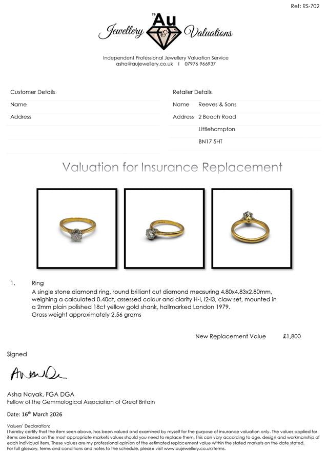 18ct yellow gold diamond ring with a single sparkling stone, showcasing elegant jewelry design.