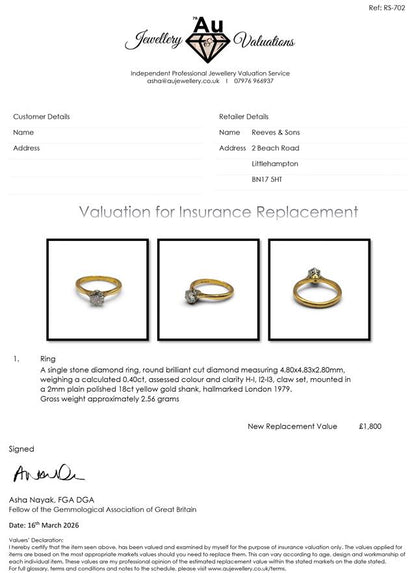 18ct yellow gold diamond ring with a single sparkling stone, showcasing elegant jewelry design.