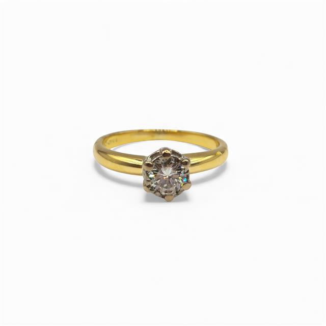18ct yellow gold diamond ring with a single sparkling diamond stone, elegant jewelry piece.