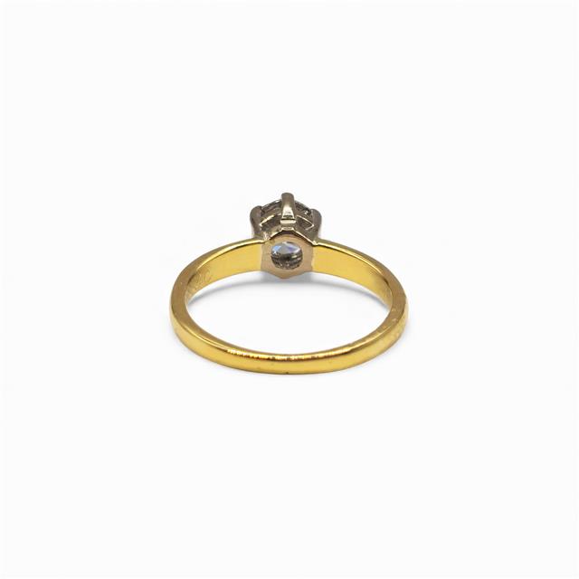 18ct yellow gold diamond ring with a single sparkling stone, showcasing elegant craftsmanship and a classic design.