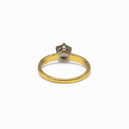 18ct yellow gold diamond ring with a single sparkling stone, showcasing elegant craftsmanship and a classic design.