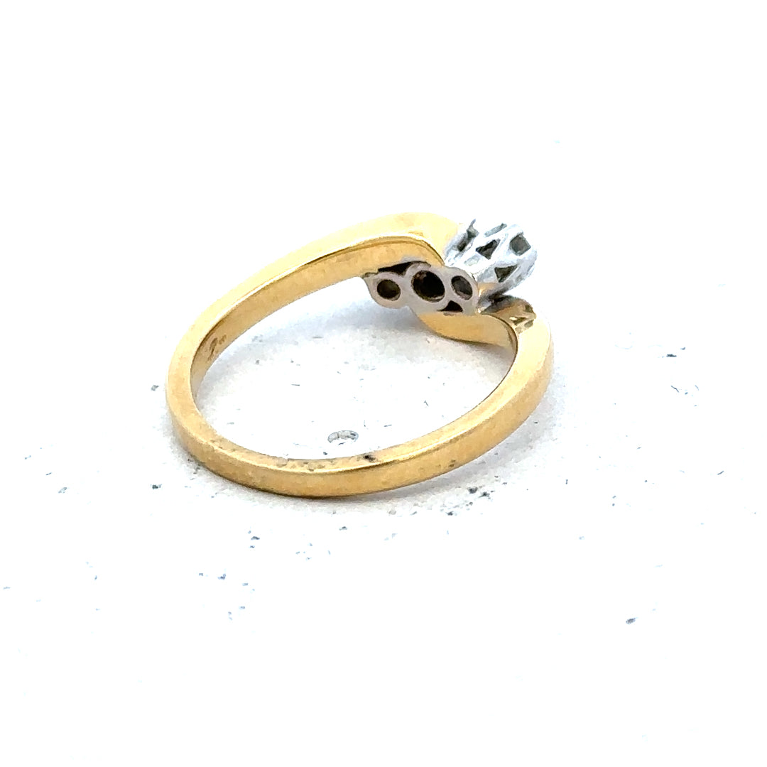 18ct yellow gold three-diamond ring with a sleek band and sparkling diamonds, elegant jewelry for special occasions