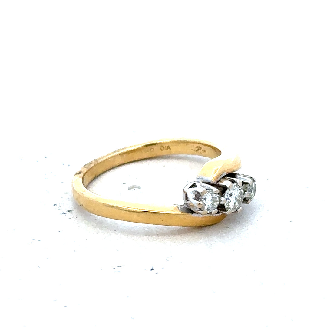 18ct yellow gold three-diamond ring with a sleek band and sparkling diamonds, elegant jewelry piece for special occasions