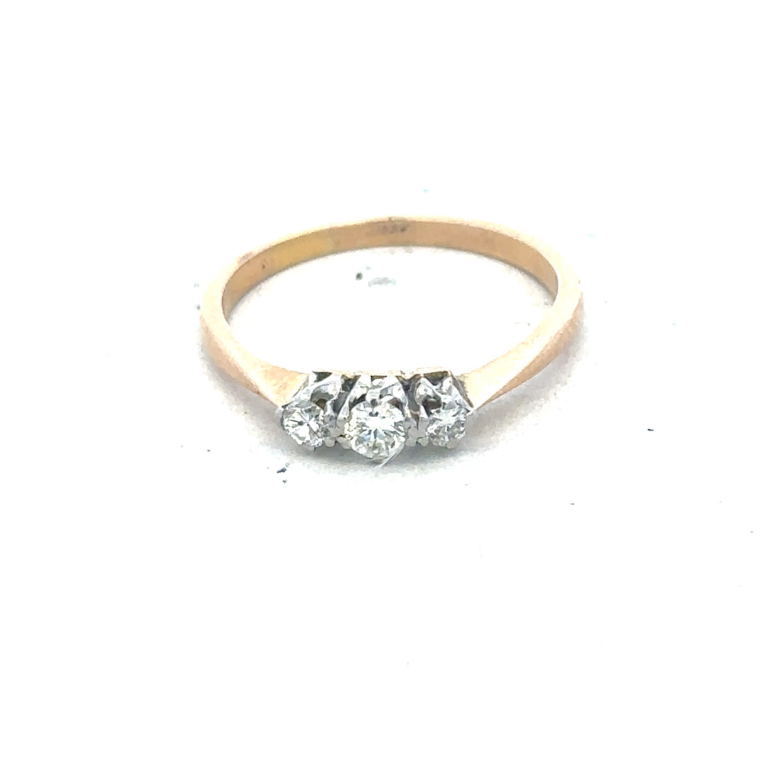 18ct yellow gold three diamond ring with a polished band, showcasing sparkling diamonds set in a classic design.