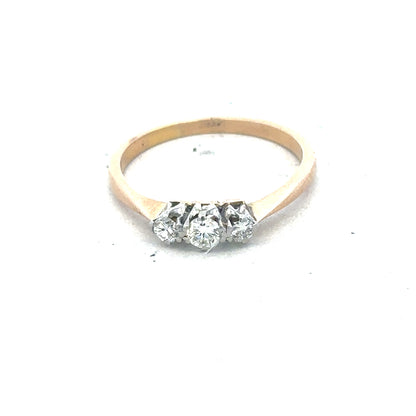 18ct yellow gold three diamond ring with a polished band, showcasing sparkling diamonds set in a classic design.